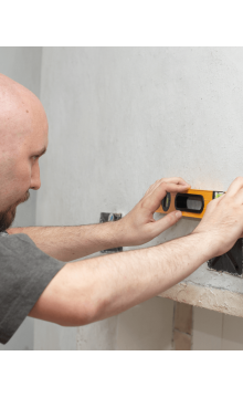 Electrician installing wall outlets 