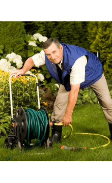 Gardener caring of flowers outdoor